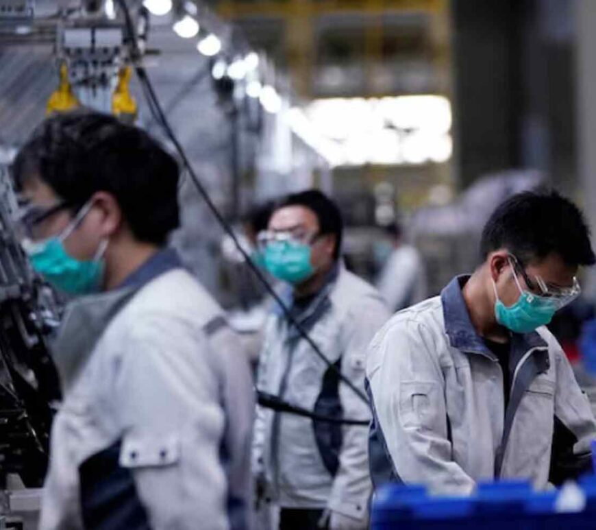 Employees work on a car seat assembly line in Shanghai, China.