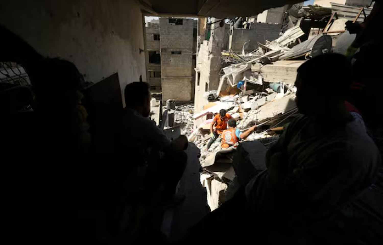 Rescuers-work-to-recover-the-body-of-a-Palestinian-girl-from-under-the-rubble-of-a-house-hit-in-an-Israeli-strike-in-Gaza-City