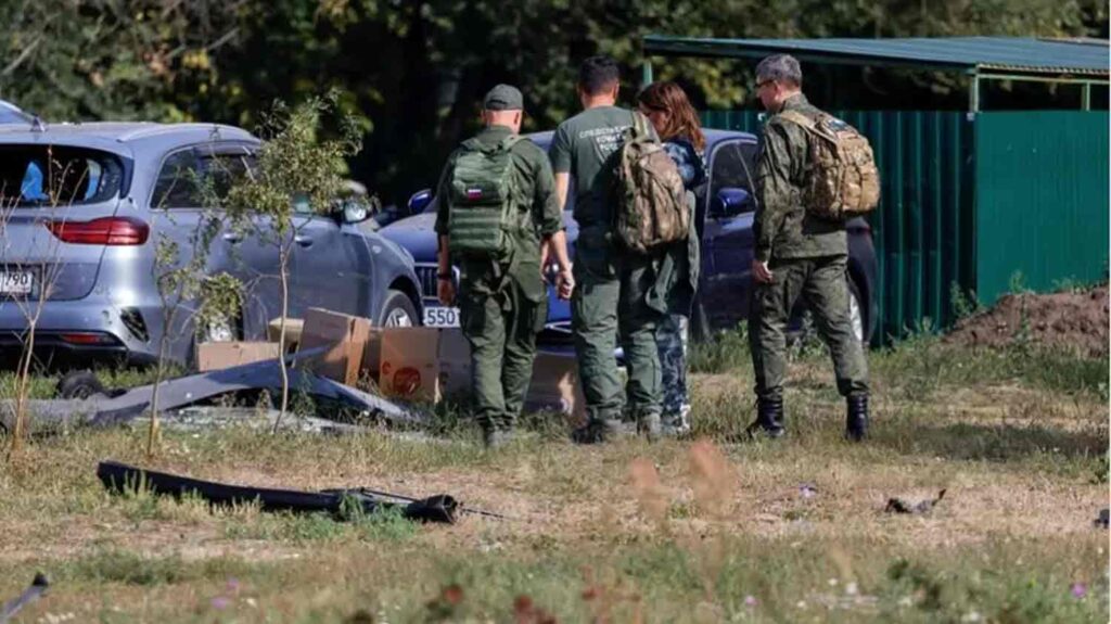 Investigators work in the courtyard of a damaged multi-story residential building following an alleged Ukrainian drone attack in the course of Russia-Ukraine conflict, in Ramenskoye in the Moscow region, Russia