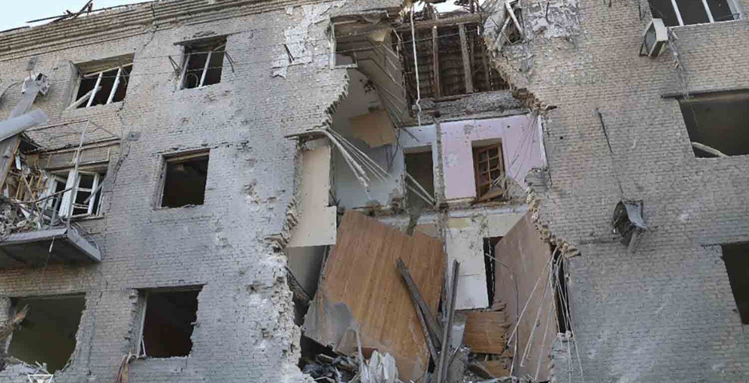 In this photo provided by the Ukrainian Emergency Service, a damaged apartment house is seen after Russia attacked the city with guided bombs overnight in Zaporizhzhia, Ukraine