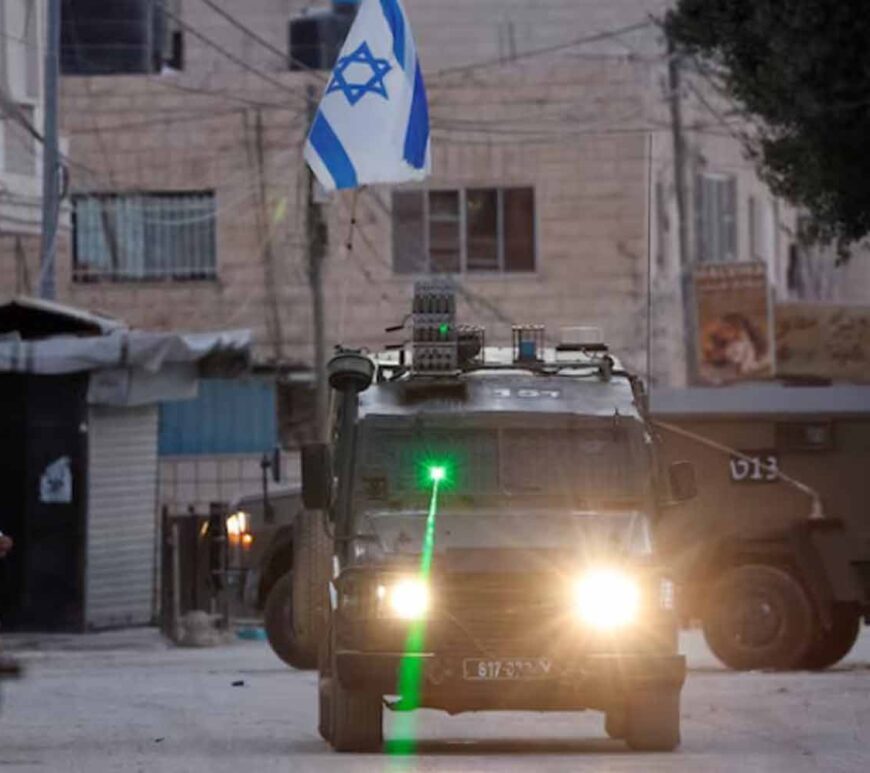 A military vehicle with a laser transits during an Israeli raid in Jenin, in the Israeli-occupied West Bank