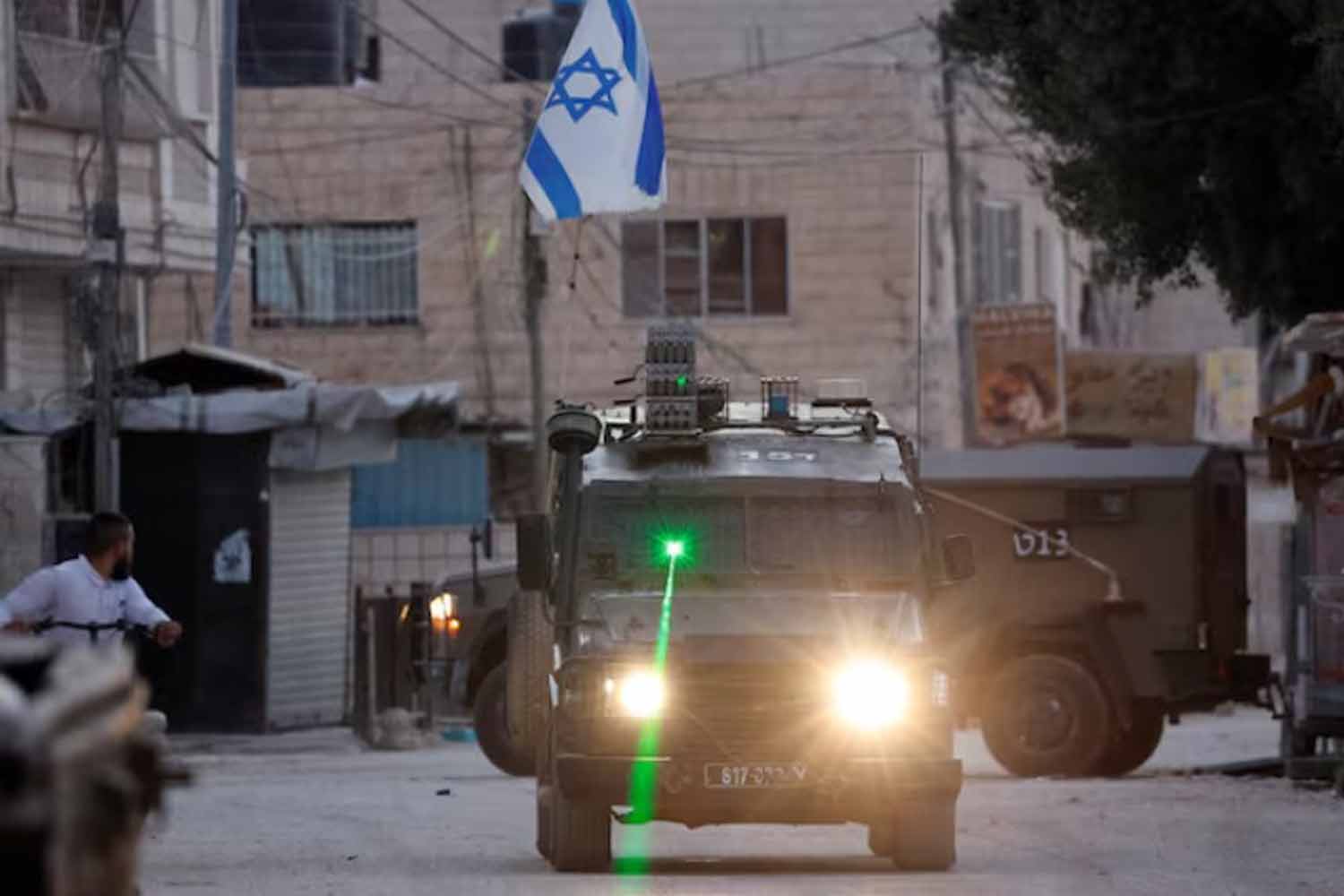 A military vehicle with a laser transits during an Israeli raid in Jenin, in the Israeli-occupied West Bank