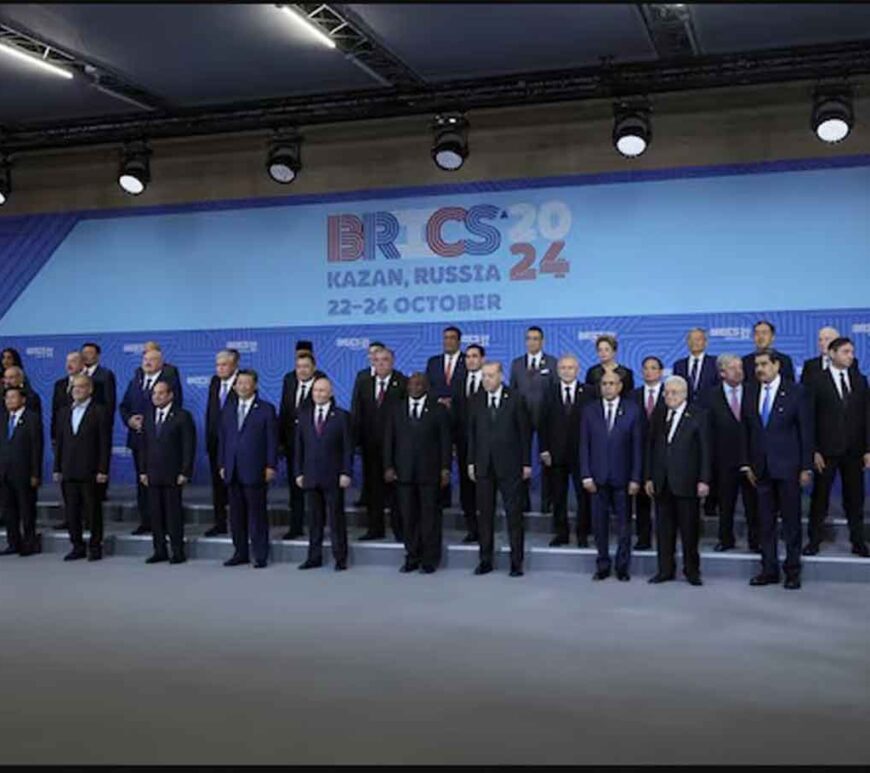 Russian President Vladimir Putin and participants in the outreach/BRICS Plus format meeting pose for a family photo during the BRICS summit in Kazan, Russia.