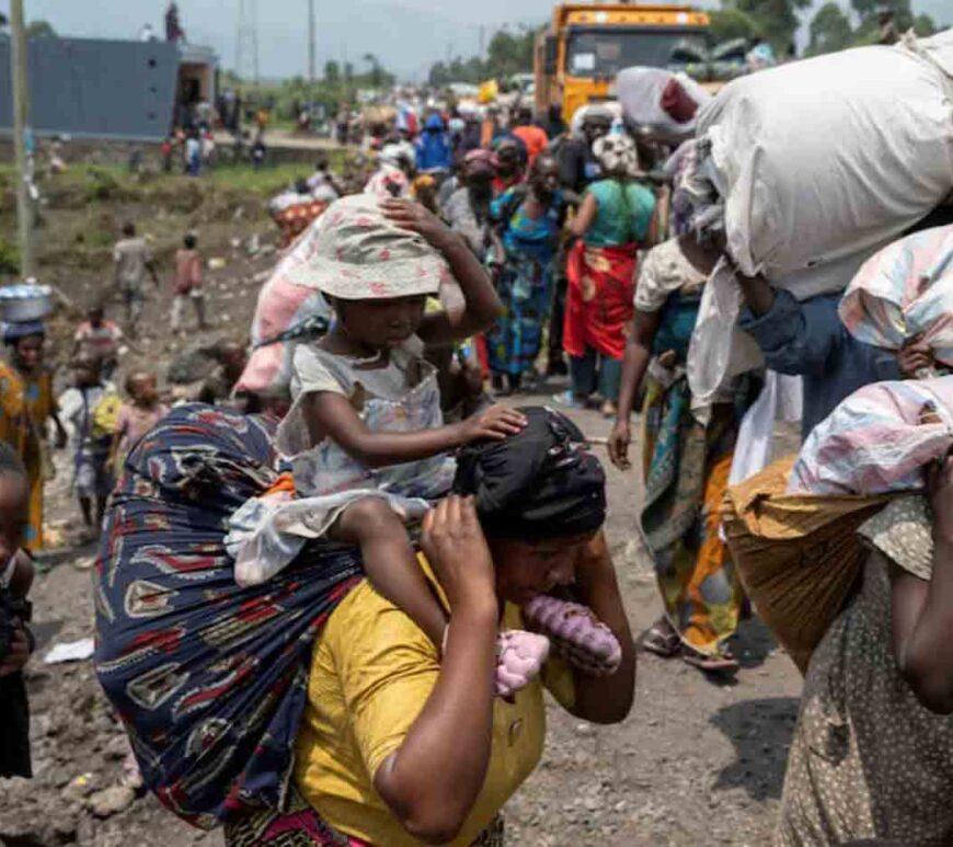 Congolese people carry their belongings as they flee from their villages around Sake in Masisi territory, following clashes between M23 rebels and the Armed Forces of the Democratic Republic of the Congo (FARDC); towards Goma, North Kivu province of the Democratic Republic of Congo.