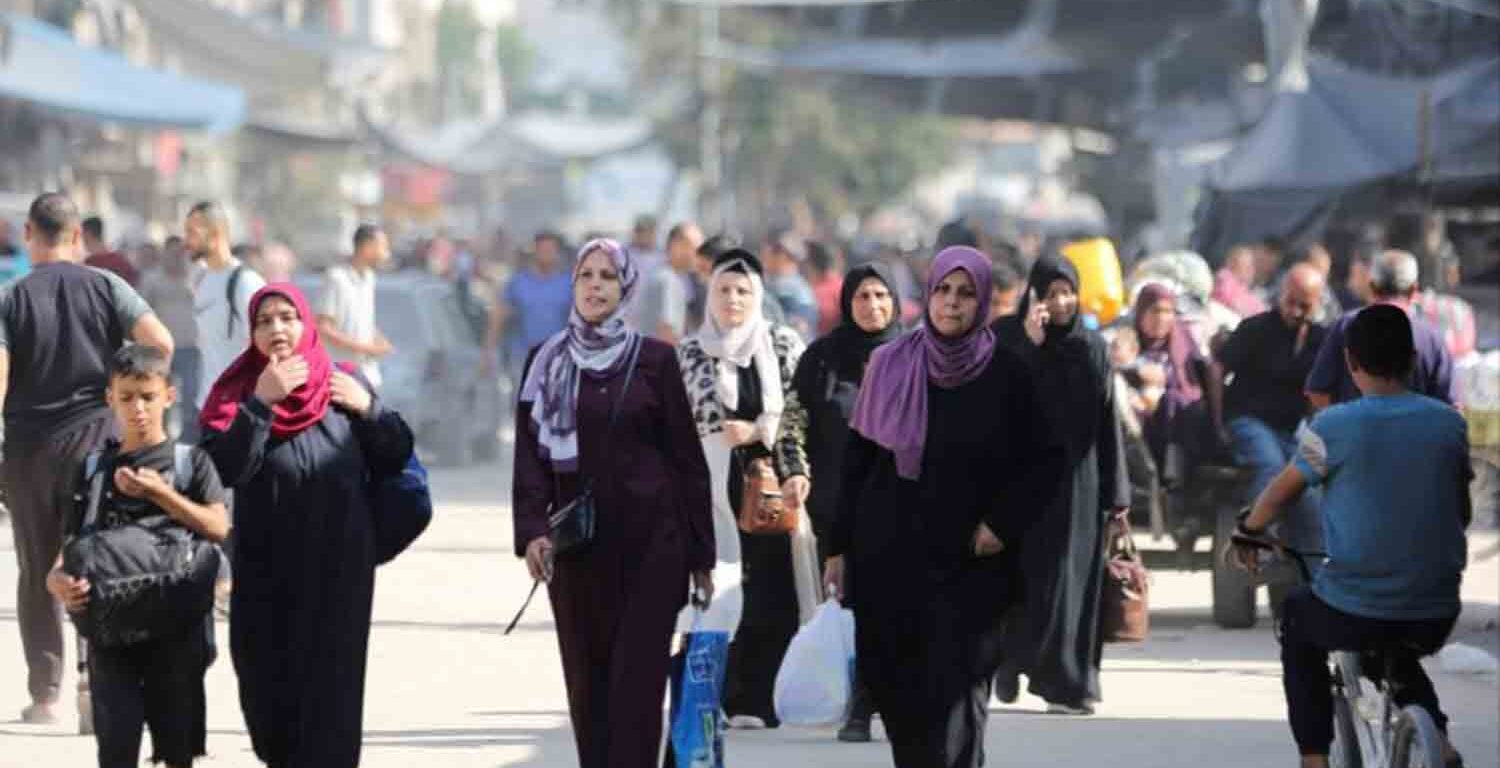 Displaced Palestinians make their way as they flee areas in the northern Gaza Strip, following an Israeli evacuation order, amid the Israel-Hamas conflict, in Gaza City.