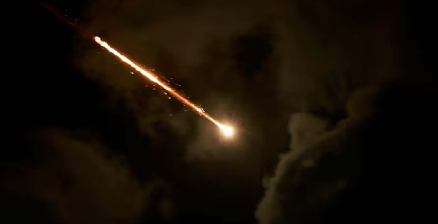 A projectile is seen in the sky after Iran fired a salvo of ballistic missiles, amid cross-border hostilities between Hezbollah and Israel, as seen from Tel Aviv, Israel.