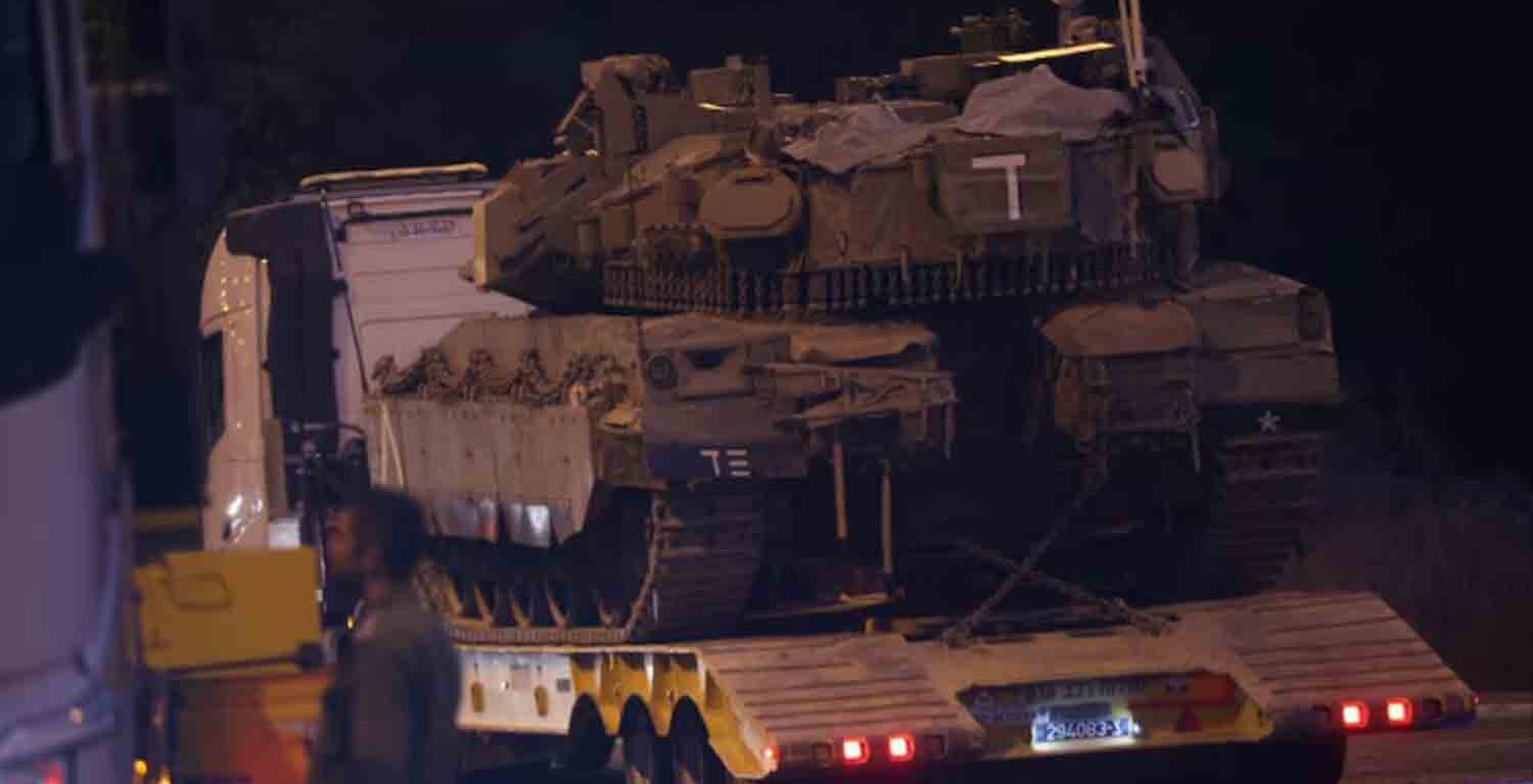 Israeli Army tank is transported, amid cross-border hostilities between Hezbollah and Israel, in northern Israel.