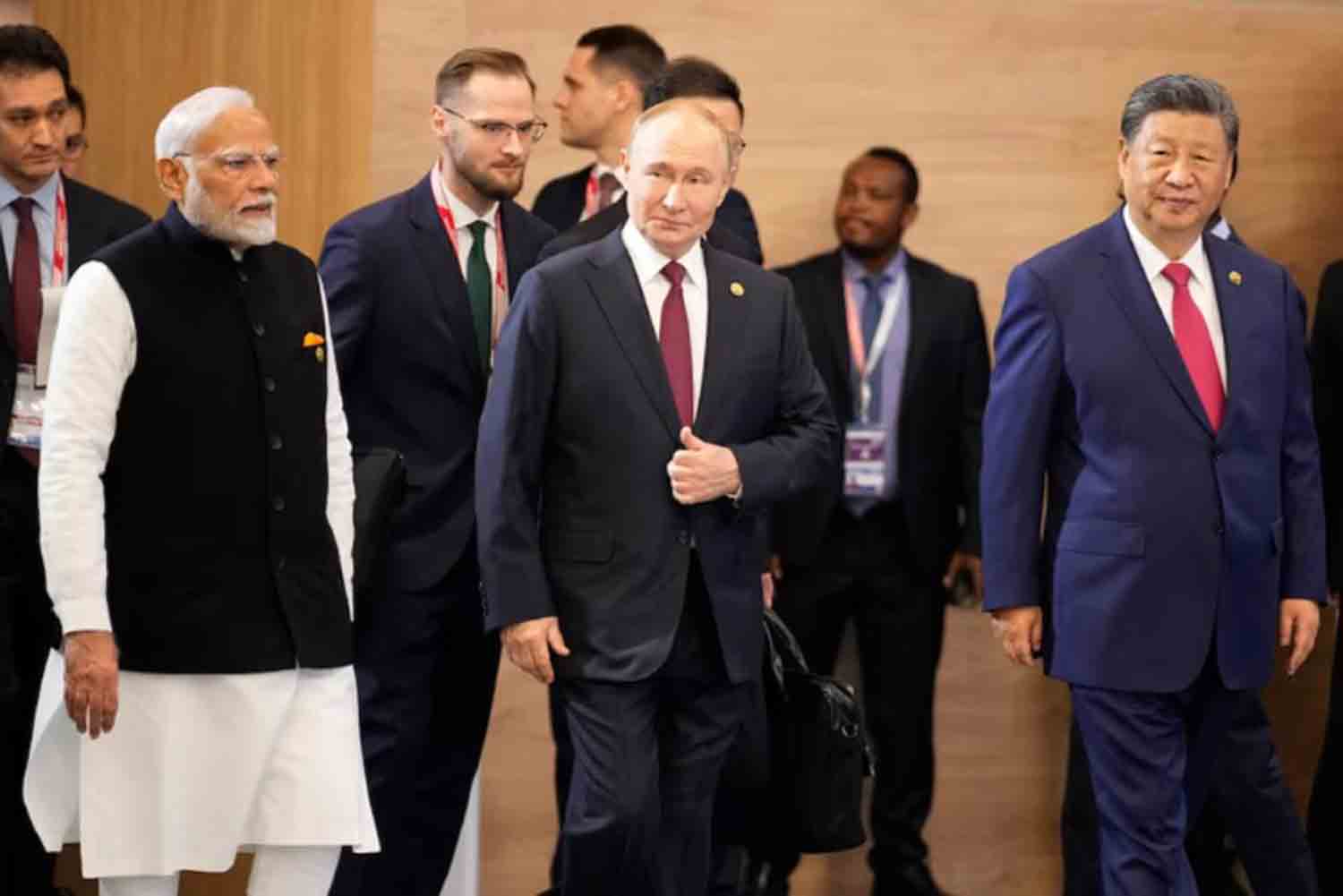 Narendra-Modi,-Vladimir-Putin-and-Xi-Jinping Indian Prime Minister Narendra Modi, Russian President Vladimir Putin and Chinese President Xi Jinping attend a family photo ceremony prior to the BRICS Summit plenary session in Kazan, Russia.