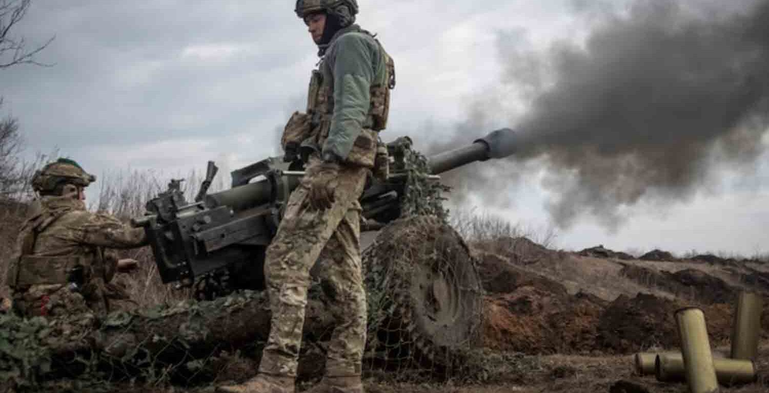 Ukrainian service members from a battalion, fire a howitzer M119 at a front line, amid Russia's attack on Ukraine, near the city of Bakhmut, Ukraine.