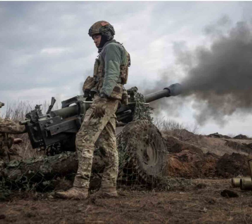 Ukrainian service members from a battalion, fire a howitzer M119 at a front line, amid Russia's attack on Ukraine, near the city of Bakhmut, Ukraine.