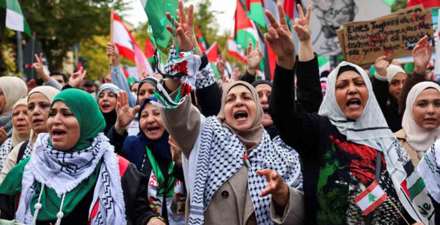 Protesters react holding Lebanese and Palestinian flags during a demonstration in solidarity with Palestinians in Gaza, ahead of the October 7 attack anniversary, amid the Israel-Hamas conflict, in Berlin, Germany.