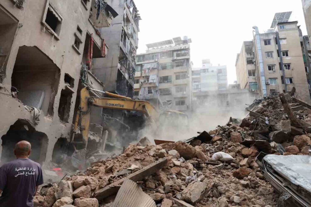 A machinery clears rubble at a site of an Israeli strike, amid ongoing hostilities between Hezbollah and Israeli forces, in Beirut, Lebanon.