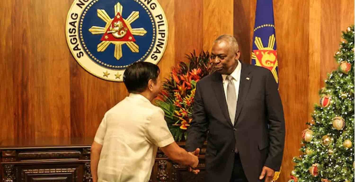 U.S. Defense Secretary Lloyd Austin shakes hands with Philippine President Ferdinand Marcos Jr during a courtesy call at the Malacanang Palace in Manila, Philippines.