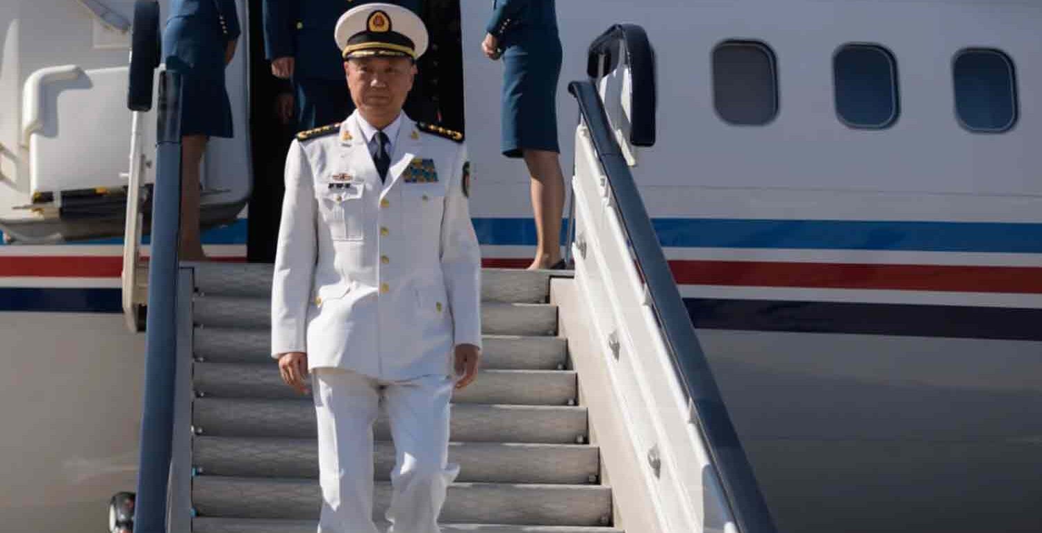 Miao Hua, director of the Political Work Department of China's Central Military Commission, disembarks his aircraft.