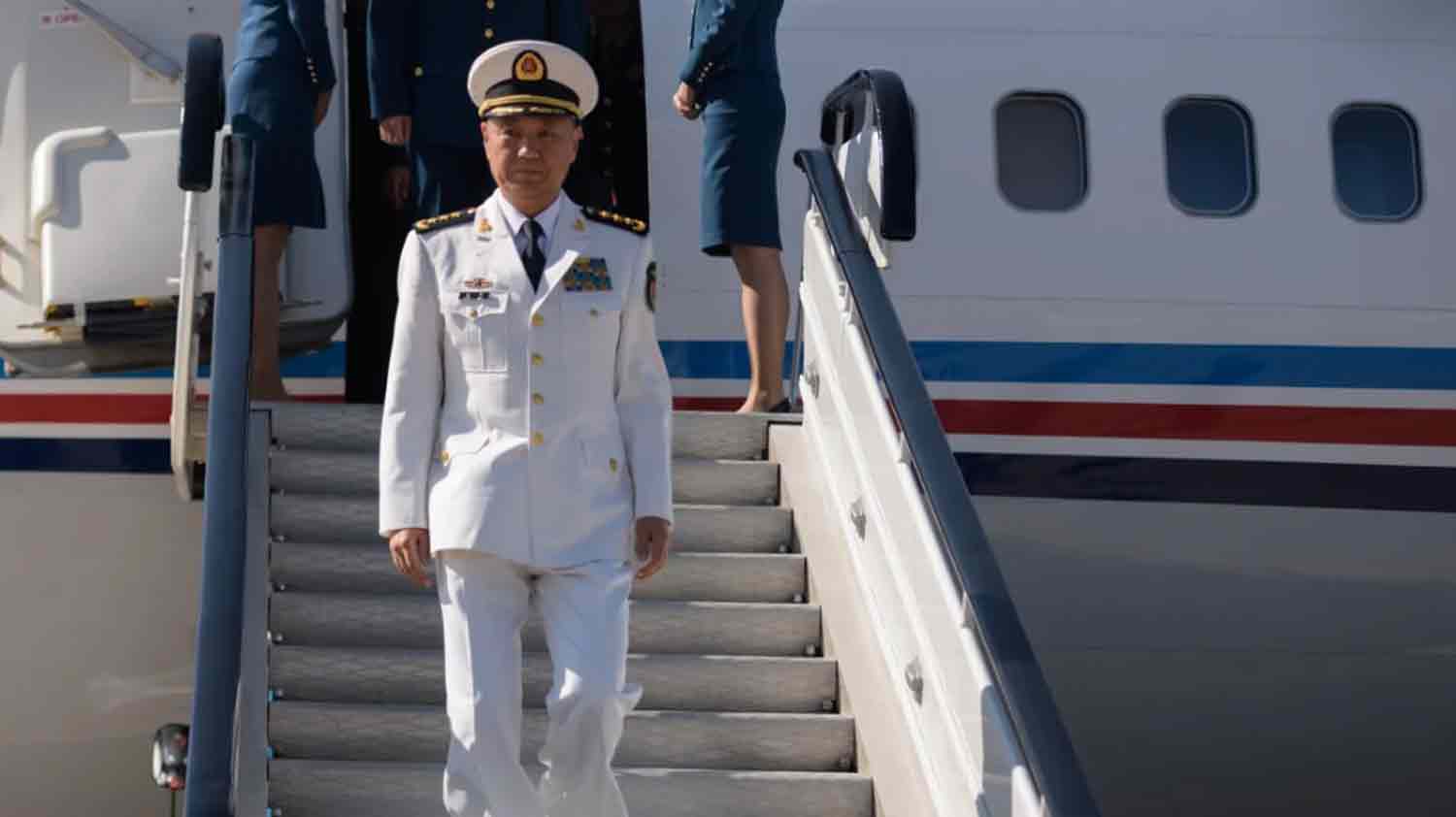 Miao Hua, director of the Political Work Department of China's Central Military Commission, disembarks his aircraft.