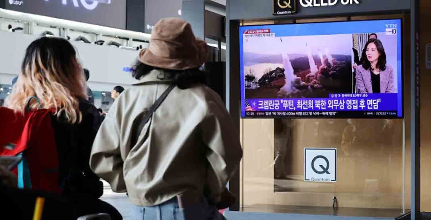 People watch a TV broadcasting a news report on North Korea firing missiles that flew 400 km after lifting off at around 7:30 a.m. from Sariwon, just south of the capital Pyongyang, at a railway station in Seoul, South Korea, November 5, 2024.