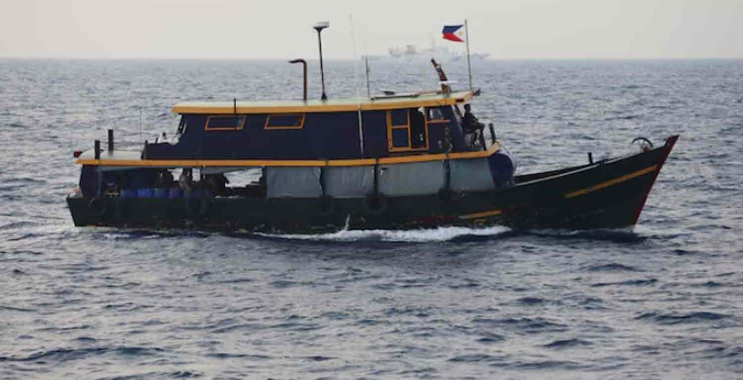 Philippine supply boat sails during a resupply mission for Filipino troops stationed at a grounded warship in the South China Sea