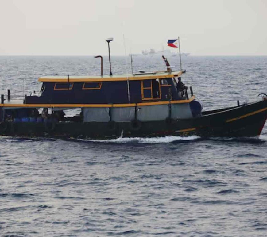 Philippine supply boat sails during a resupply mission for Filipino troops stationed at a grounded warship in the South China Sea