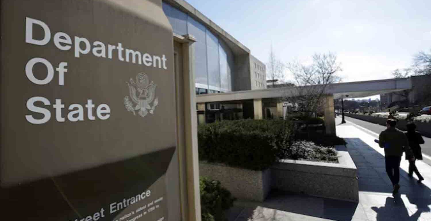 People enter the State Department Building in Washington, U.S.