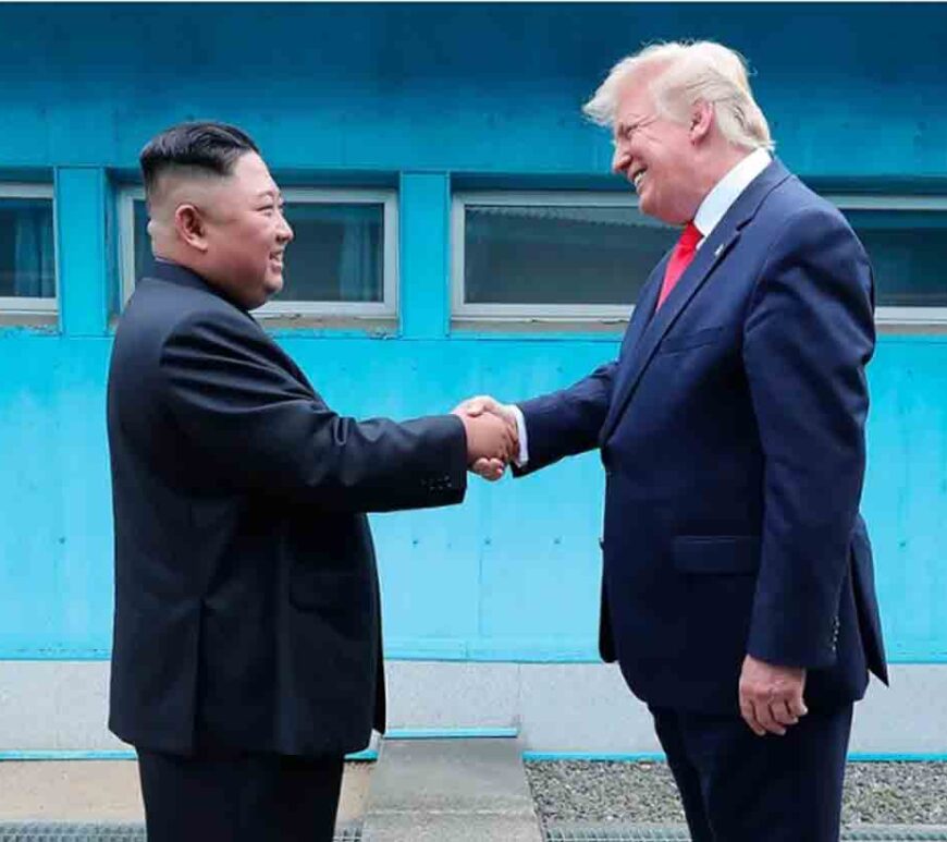 North Korean leader Kim Jong Un and U.S. then-President Donald Trump shake hands over the military demarcation line between North and South Korea on June 30, 2019.