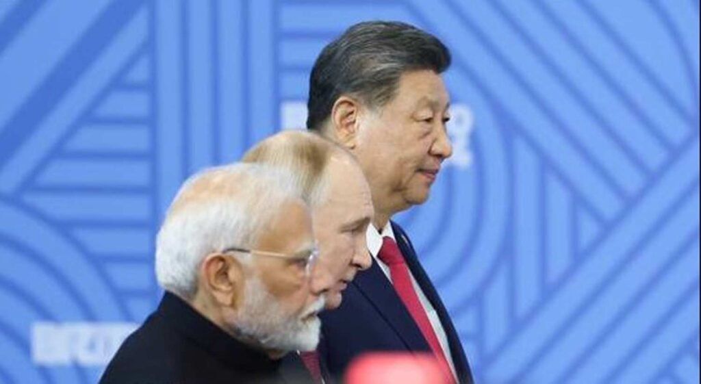 Indian Prime Minister Narendra Modi, Russian President Vladimir Putin and Chinese President Xi Jinping attend a family photo opportunity by heads of the delegations at the 16th BRICS summit in Kazan