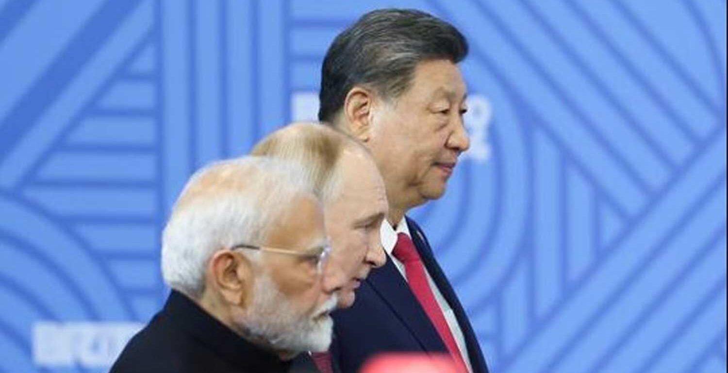 Indian Prime Minister Narendra Modi, Russian President Vladimir Putin and Chinese President Xi Jinping attend a family photo opportunity by heads of the delegations at the 16th BRICS summit in Kazan