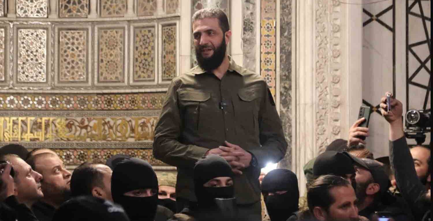 The leader of Syria's Hay'at Tahrir al-Sham (HTS) group, Abu Mohammed al-Jolani, addresses a crowd in Damascus' landmark Umayyad Mosque on 8 December, 2024.