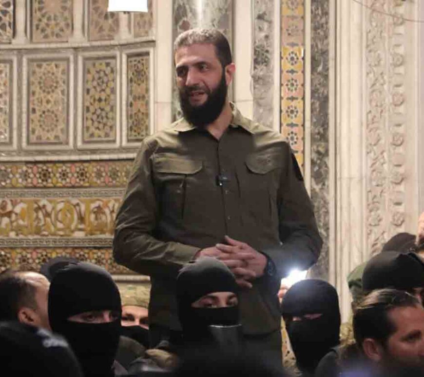 The leader of Syria's Hay'at Tahrir al-Sham (HTS) group, Abu Mohammed al-Jolani, addresses a crowd in Damascus' landmark Umayyad Mosque on 8 December, 2024.