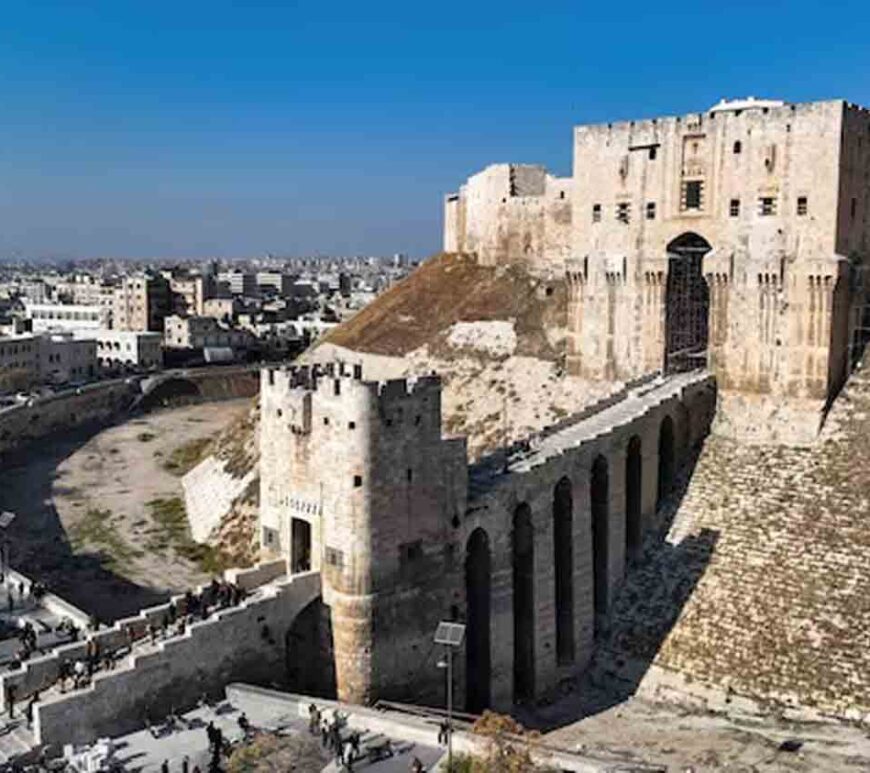 People walk at Aleppo's ancient citadel in this picture from a drone, in Aleppo, Syria.