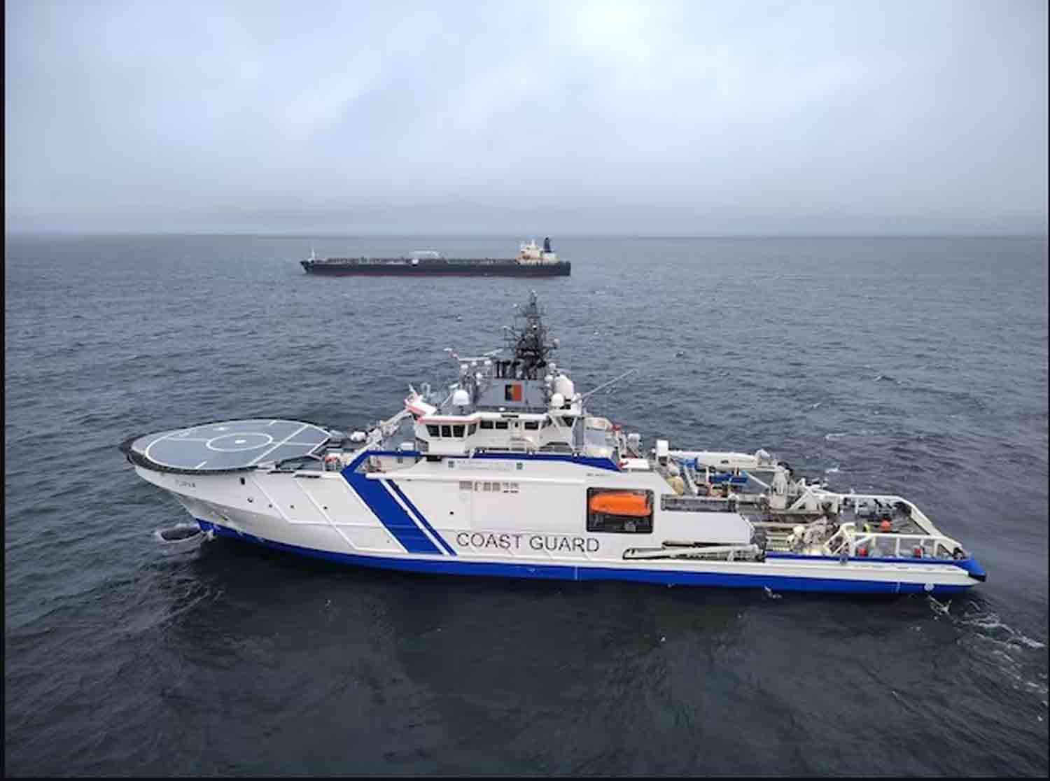 Finnish-Border-Guard's-ship Finnish Border Guard's ship Turva and oil tanker Eagle S sail on the sea outside the Porkkalanniemi, Finland.