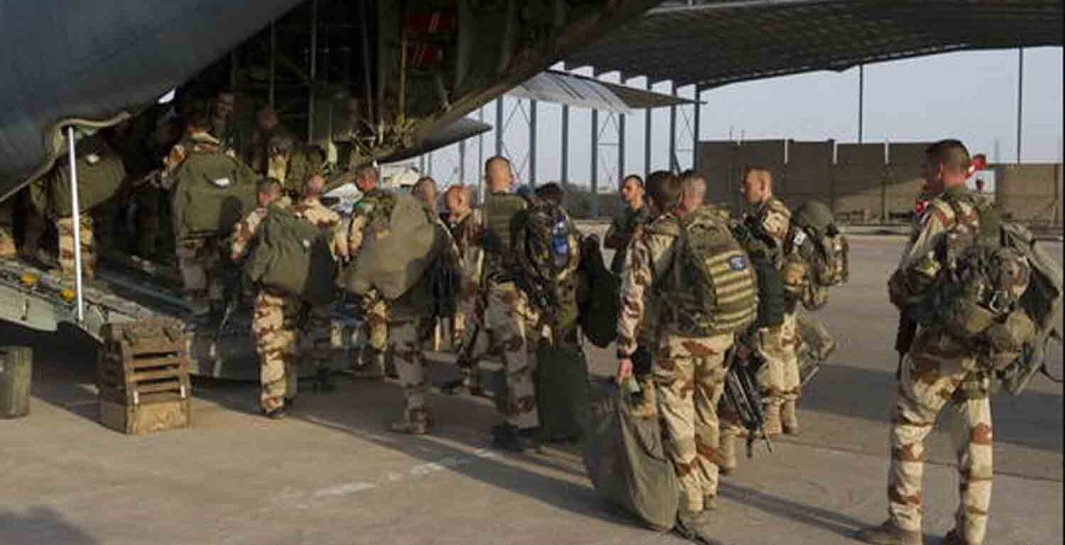 French soldiers prepare to board on a fighter plane at Kossei camp at the French military base of N'Djamena in Chad.