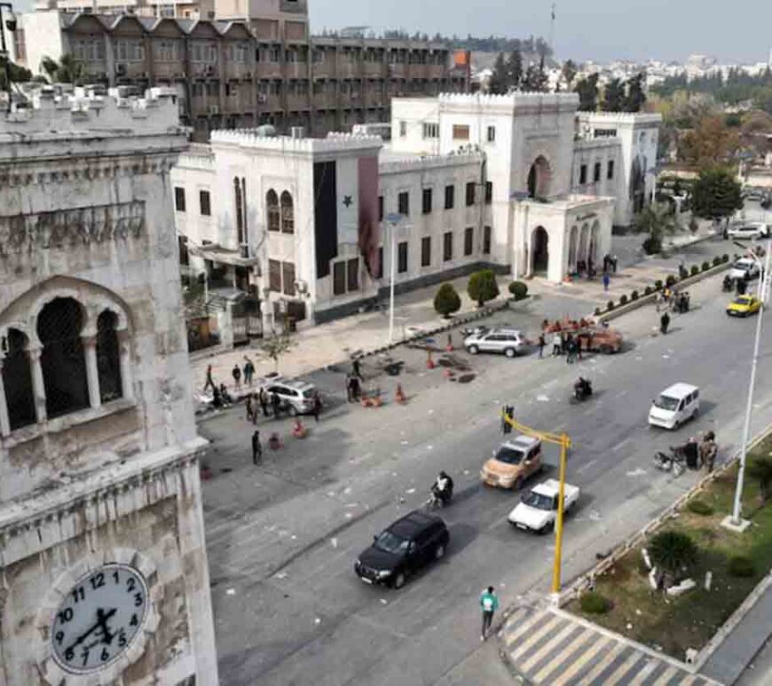 A drone view shows Hama governor's building with an image of Syrian President Bashar al-Assad, after rebels led by HTS have sought to capitalize on their swift takeover of Aleppo in the north and Hama in west-central Syria by pressing onwards to Homs, in Hama, Syria.