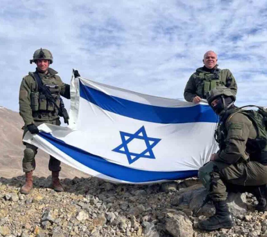 Israeli soldiers stand on Mount Hermon, in Syria.