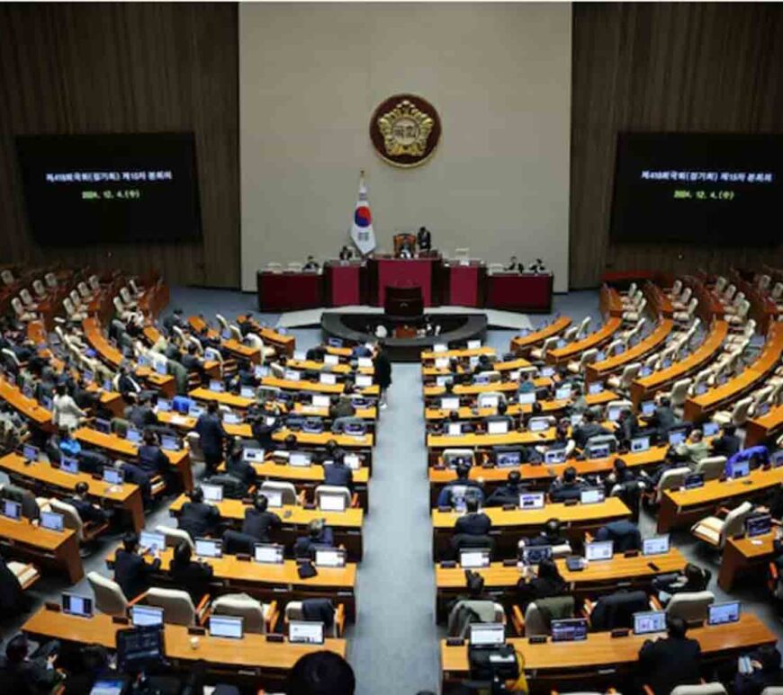 Lawmakers sit inside the hall at the National Assembly, after South Korean President Yoon Suk Yeol declared martial law, in Seoul, South Korea.