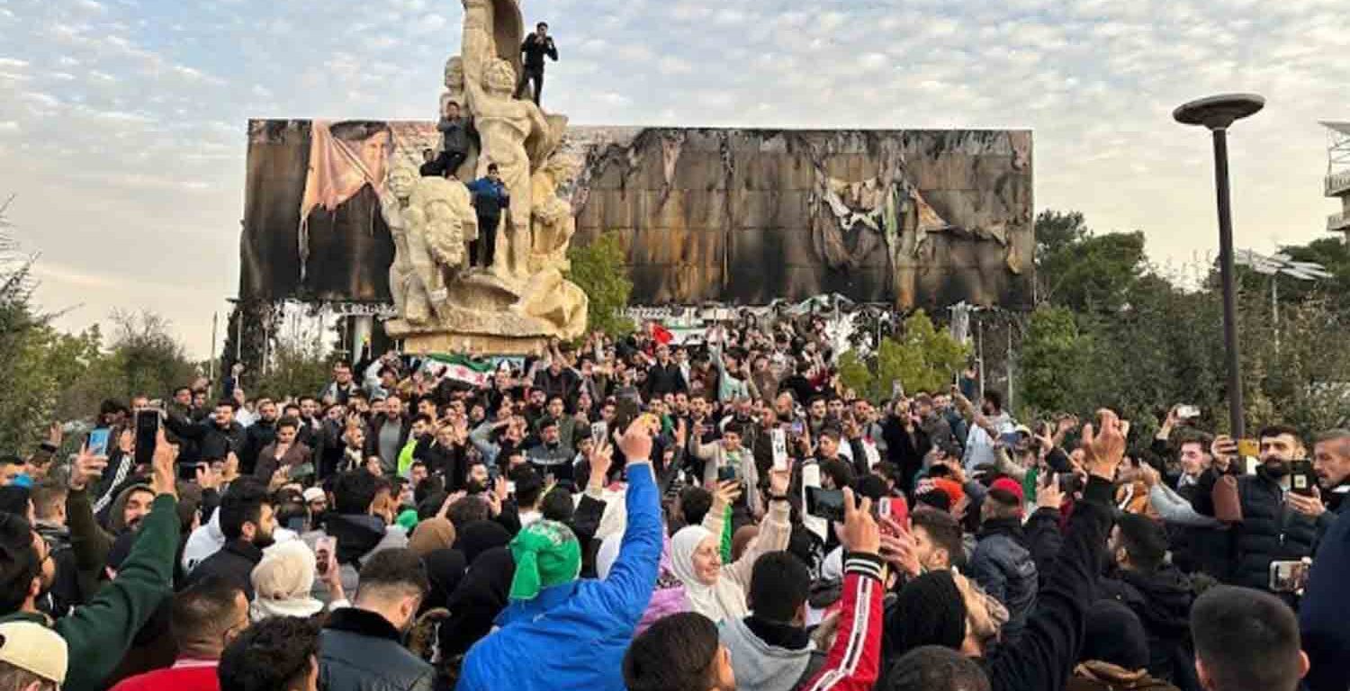 People gather at Saadallah al-Jabiri Square as they celebrate, after Syria's army command notified officers on Sunday that President Bashar al-Assad's 24-year authoritarian rule has ended, a Syrian officer who was informed of the move told Reuters, following a rapid rebel offensive that took the world by surprise, in Aleppo, Syria.