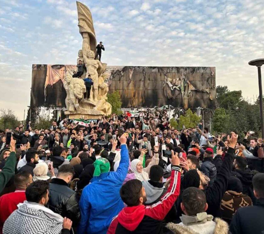 People gather at Saadallah al-Jabiri Square as they celebrate, after Syria's army command notified officers on Sunday that President Bashar al-Assad's 24-year authoritarian rule has ended, a Syrian officer who was informed of the move told Reuters, following a rapid rebel offensive that took the world by surprise, in Aleppo, Syria.