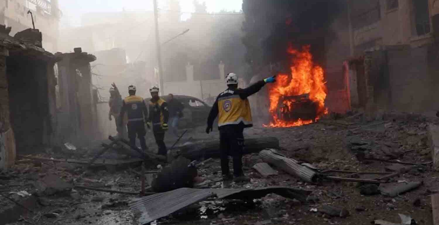 White Helmets members work at the scene of what the organisation says is a strike, in Idlib, Syria.