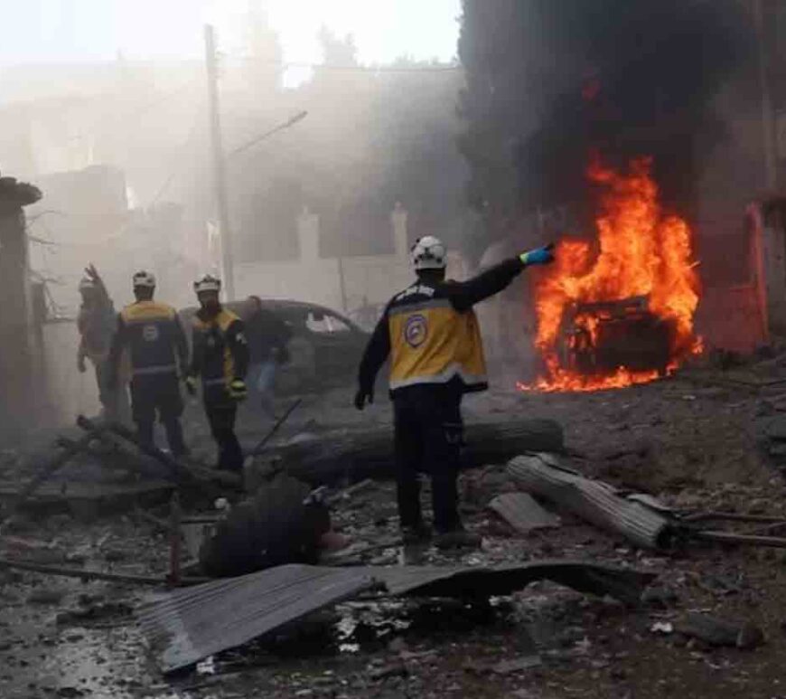 White Helmets members work at the scene of what the organisation says is a strike, in Idlib, Syria.