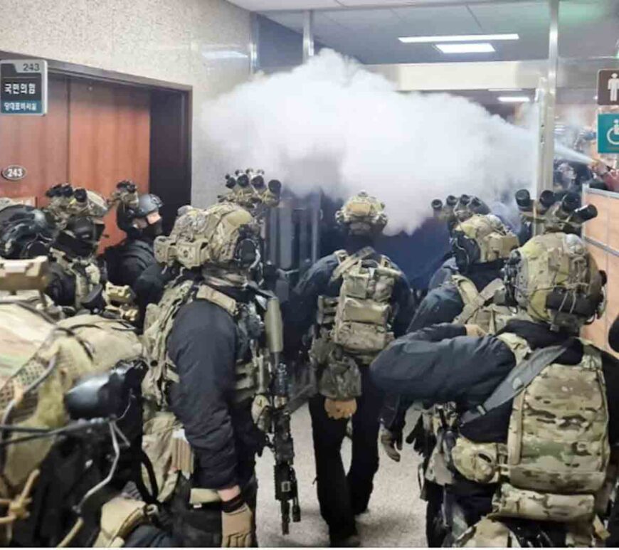 Soldiers advance to the main building of the National Assembly after South Korean President Yoon Suk Yeol declared martial law.