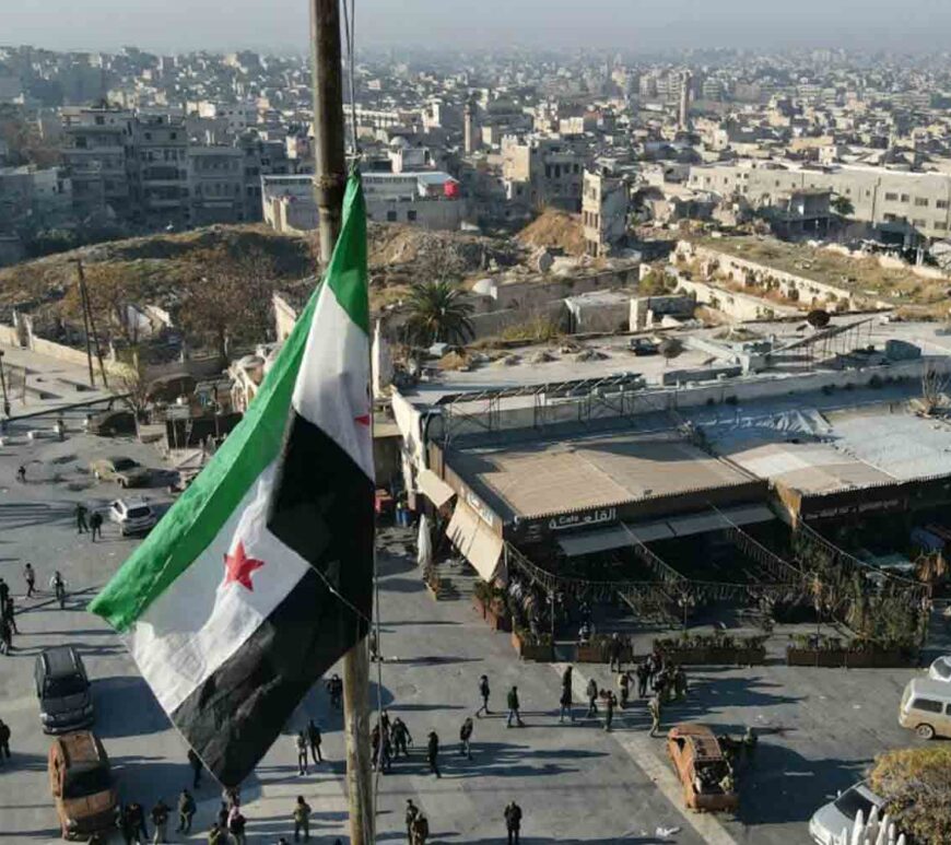 A Syrian opposition flag flies above a market square in central Aleppo.