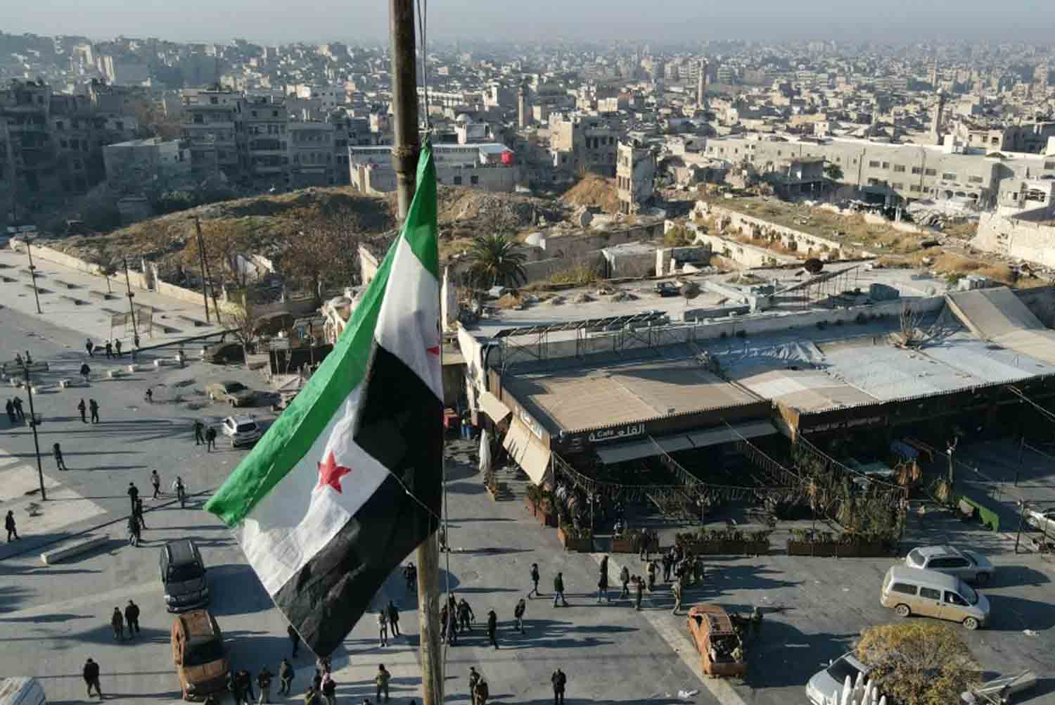 A Syrian opposition flag flies above a market square in central Aleppo.