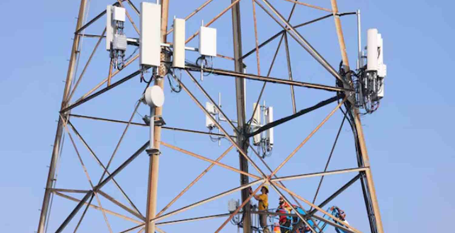 Technicians install 5G equipment on a utilities tower in Redondo Beach, California, U.S.,