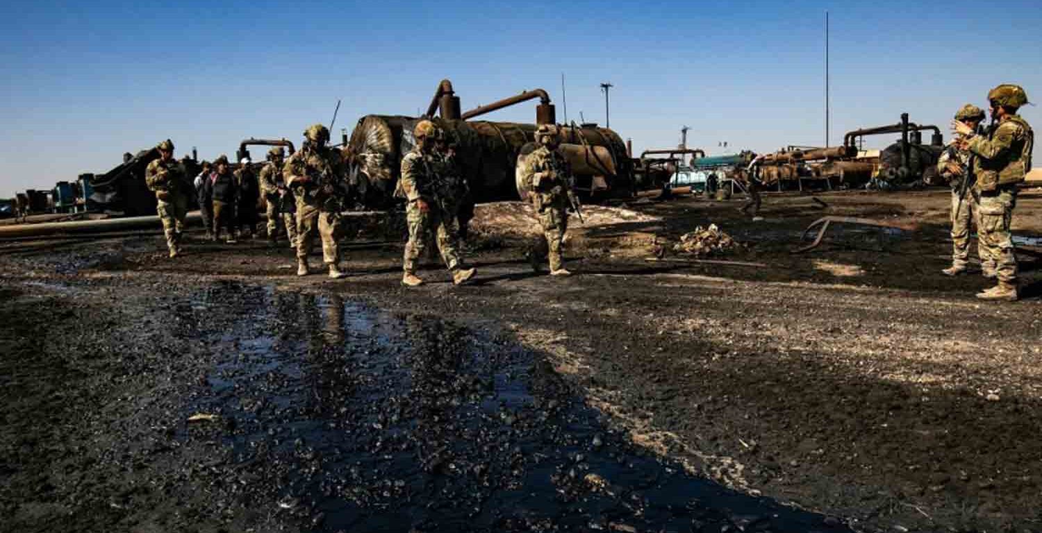 US soldiers inspect the site of reported Turkish shelling days earlier on an oil extraction facility on the outskirts of Rumaylan, in Syria's Kurdish-controlled northeastern Hasakeh province.