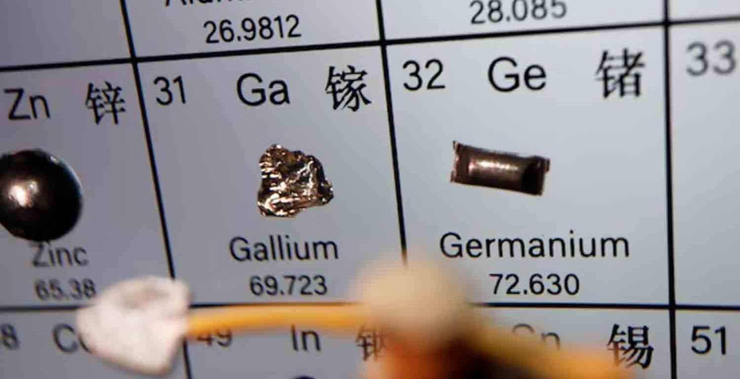 A worker miniature is placed near the elements of Gallium and Germanium on a periodic table, in this illustration picture.