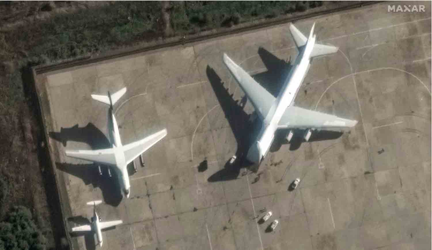satellite image shows An-124 heavy transport aircraft with its nose cone lifted, at Russian Khmeimim airbase, near Latakia, Syria, December 13, 2024.