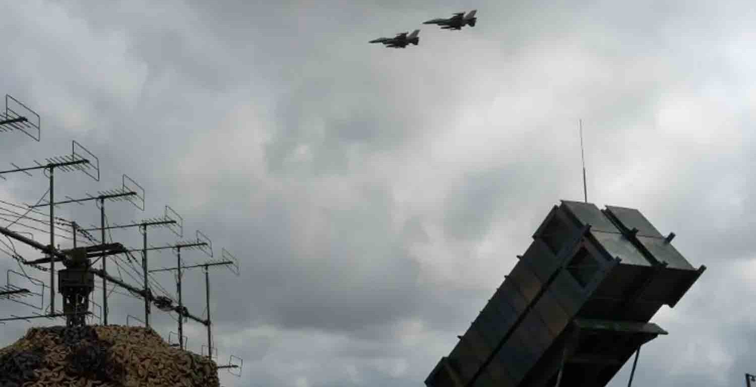 F-16 fighter jets fly over a Patriot battery in an undisclosed location in Ukraine.