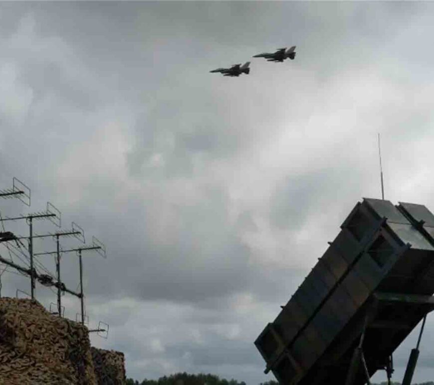 F-16 fighter jets fly over a Patriot battery in an undisclosed location in Ukraine.