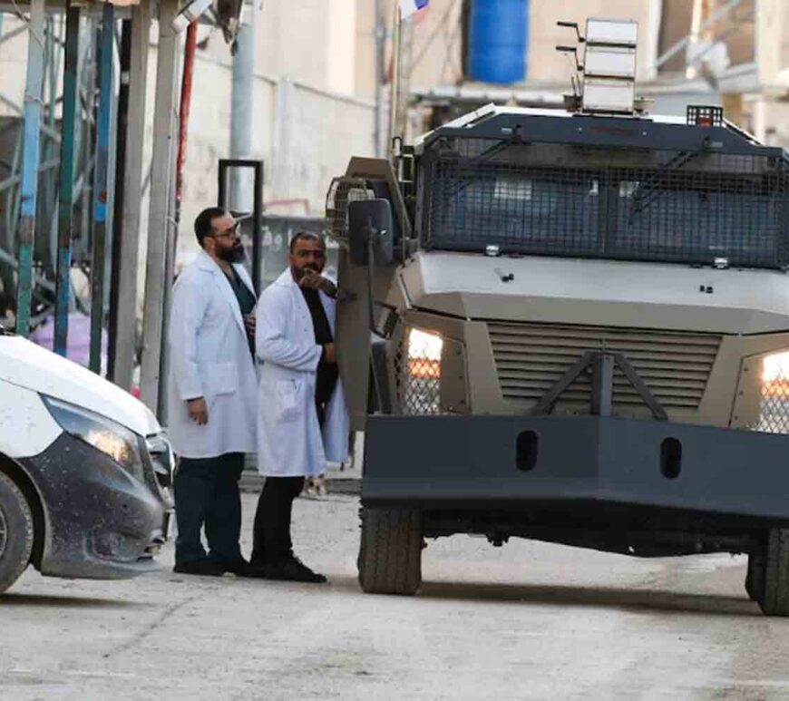 An Israeli military vehicle stands on the street during an Israeli raid, in Jenin, in the Israeli-occupied West Bank.