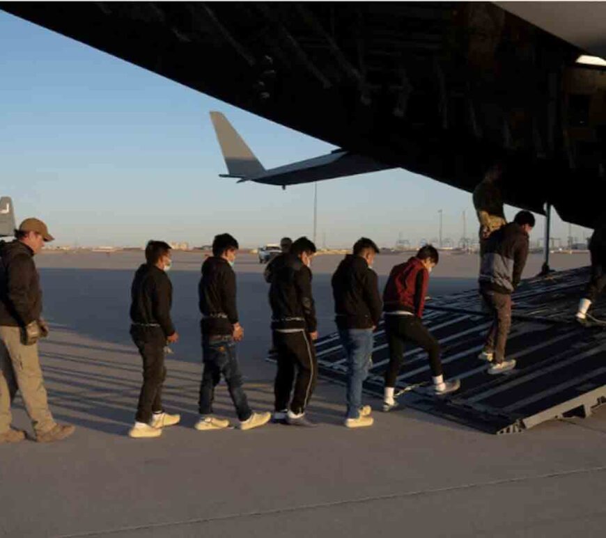 Migrants board a C-17 Globemaster III aircraft for a removal flight, Fort Bliss, Texas.