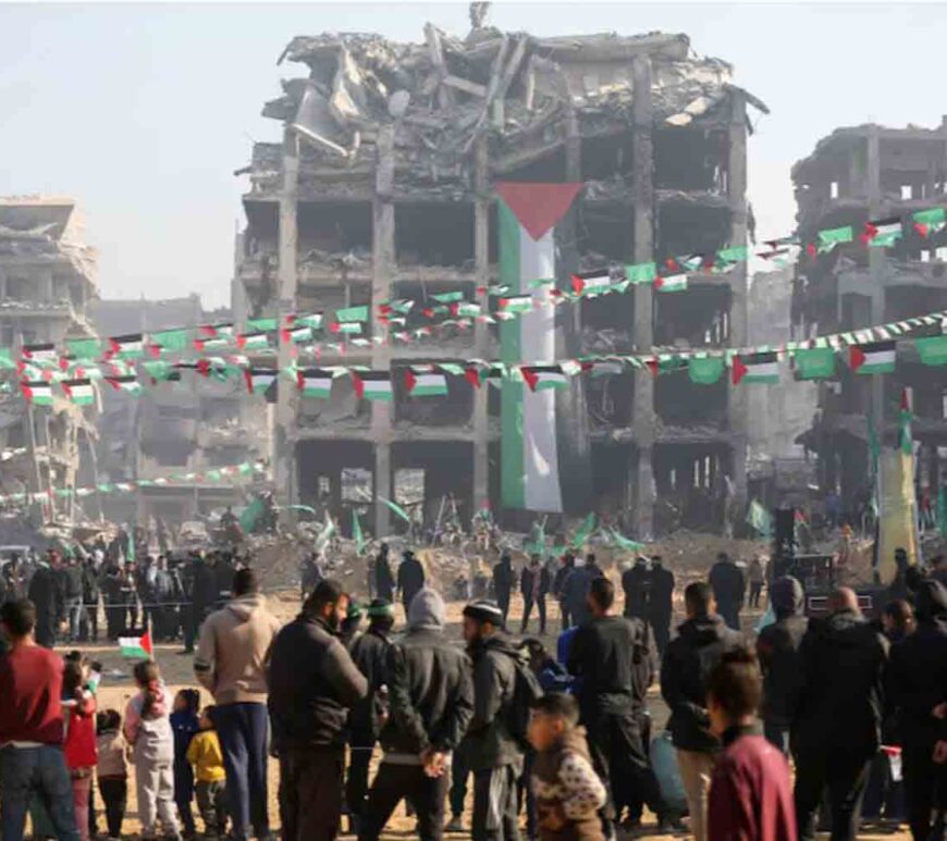 People gather ahead of the handover of hostages, held in Gaza since the deadly October 7 2023 attack, to members of the International Committee of the Red Cross (ICRC) as part of a ceasefire and a hostages-prisoners swap deal between Hamas and Israel, in Jabalia, in the northern Gaza Strip.